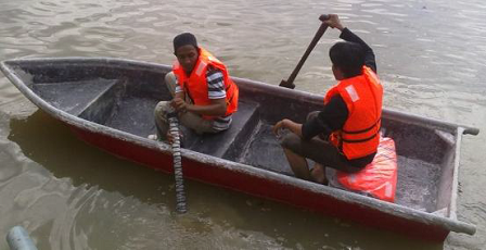 Small boat made of fiberglass hybrid composite and sugar palm material